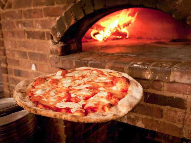 What started as a neighborhood pizza joint in one of Brooklynâ  s old-time Italian enclaves has transformed into a multi-city sensation. Former marble worker Mark Iacono found his true calling with New York-style pies served in a quaintly old-fashioned setting. In 2013, Iacono decided to take his brick-oven, New York-style pies and creative salads to South Beach. The Sunshine State spinoff is just as enticing as the original, attracting a large following of locals and â   the true test of pizza quality â   plenty of NYC expats.