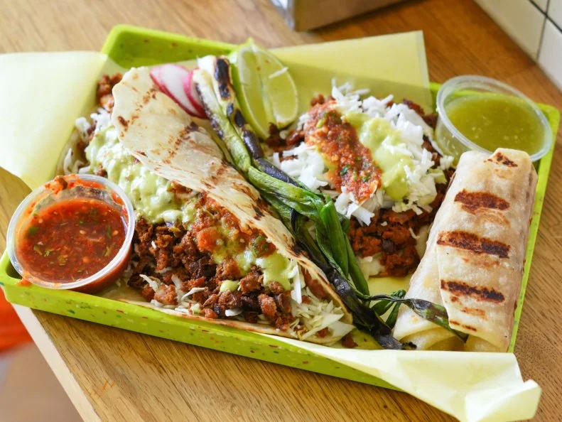 Sonoratown hooks diners as soon as they walk through the door. The tiny, vibrantly colorful downtown taqueria pulses with energetic Mexican music. The Northern Mexican food is as bright as the decor. Try the Lorenza ($4), a crispy corn tostada with Monterrey jack, salsa, avocado and cabbage — also available vegetarian with poblano chile and pinto beans.