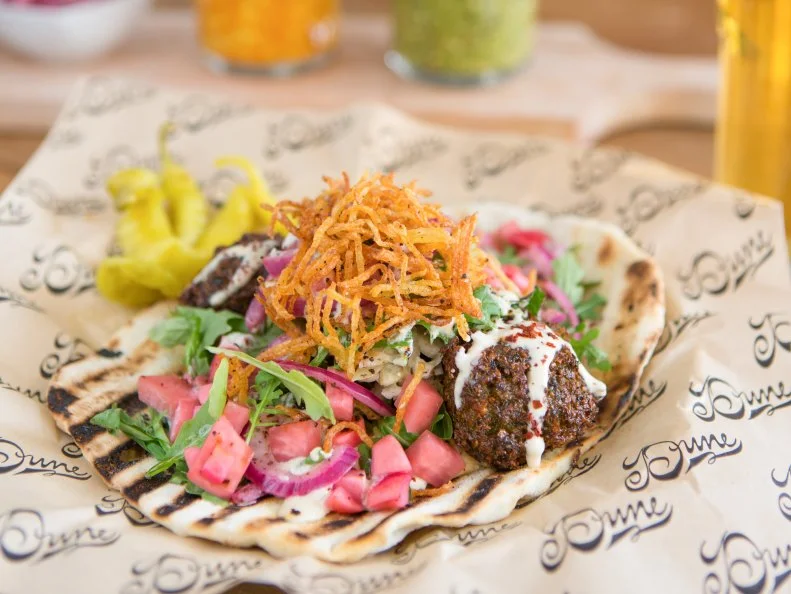 Atwater Village has gained prominence for years as a food destination, thanks to the range of low key eateries along Glendale Boulevard. One of the staple spots along the main stretch is Dune, a Mediterranean gem. Get the falafel sandwich ($9.50), a mess of house flat bread, herbaceous falafel, hummus, house pickles, marinated cabbage and onions, tahini and shoestring potatoes.