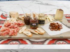 A meat and cheese board is displayed as seen on The Kitchen, Season 15.