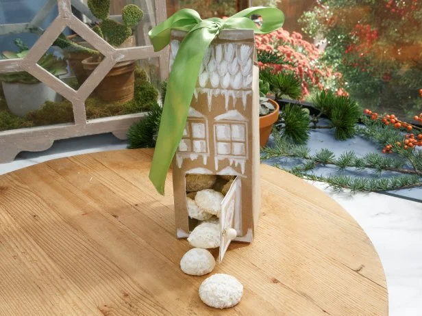 Sunny Anderson's Milk Carton Gingerbread House is displayed as seen on The Kitchen, Season 15.