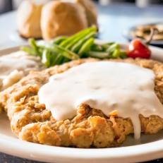 Cultural geography buffs might argue that Texas isn’t really part of The South, but that hasn’t stopped the city from cultivating its own signature style of soul food. At the heart of a Texas meat-and-three is the chicken-fried steak, a heart-stopping battered and breaded filet of beef smothered in creamy white gravy. Fierce debates revolve around the city’s best, but for one served with a side of Austin music history, Threadgill’s is the place to go. The walls are decked with pieces of music history, and even a quick hello to proprietor Eddie Wilson, the original manager of the long-lost Armadillo World Headquarters, can spin into an hour-long chat about the first time Willie graced their iconic stage.