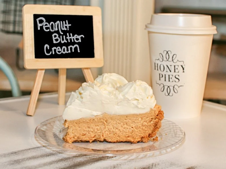 Once a popular food truck, Honey Pies serves pie in a homey brick and mortar, where locals head for pie, coffee and local Loblolly Creamery ice cream. A favorite is the rich peanut butter cream pie with a fluffy layer of peanut butter cream piled high with whipped cream on top. Itâ  s perfect pie equivalent to a peanut butter cookie.