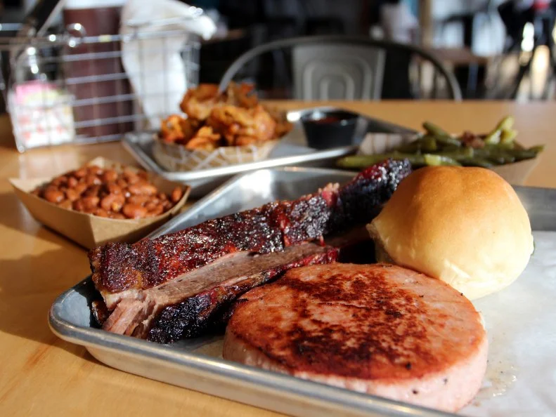 Chef Travis McConnell’s recent relocation to the area is good news for meat lovers, who can pick up prime cuts of beef, lamb, pork and more alongside housemade sausages of note in the butcher shop portion of this combination store and eatery. For those who’d like someone else to do the cooking, there are such delicacies as smoked brisket, chops and even fried chicken skins, and a lovely array of local beer on tap to go along with them.