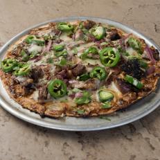 The Burnt Ends St. Louis style pizza at Frasher's Smokehouse, as seen on Eat Sleep BBQ, Season 1.