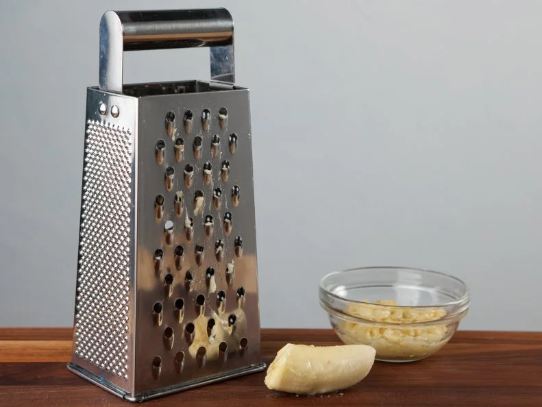 Food Network Kitchen’s Grating Bananas for Food Network's 14 Reasons to Love Your Box Grater, as seen on Food Network.