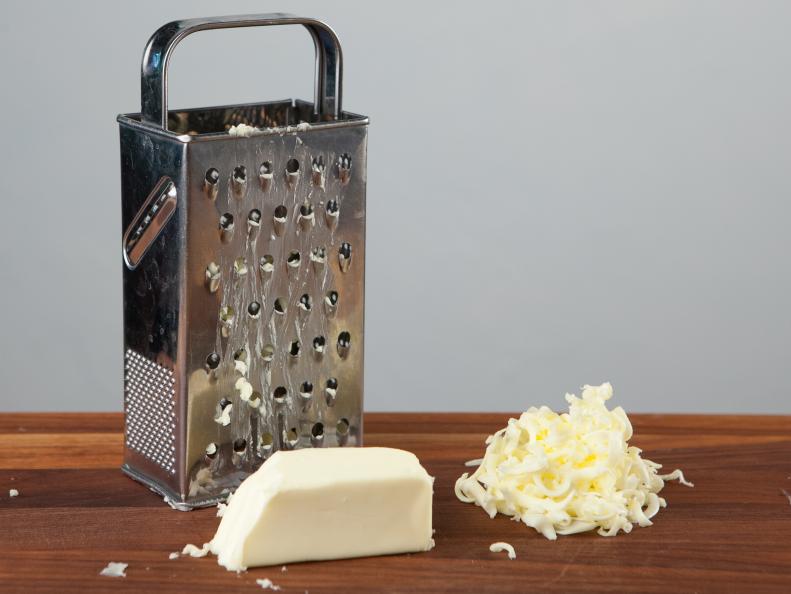 Food Network Kitchen’s  Grating Butter for Food Network's 14 Reasons to Love Your Box Grater, as seen on Food Network.