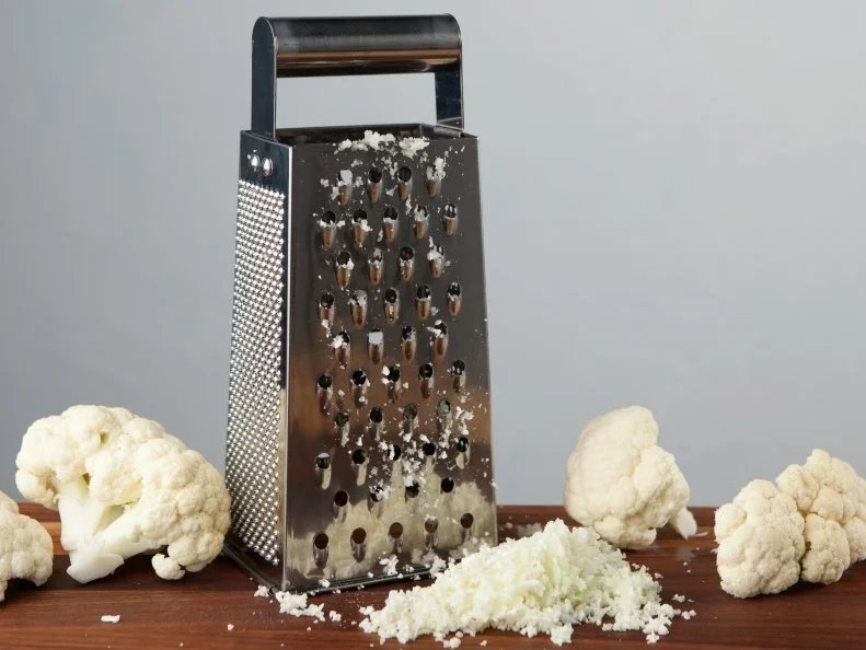 Food Network Kitchen’s Grating Cauliflower for Food Network's 14 Reasons to Love Your Box Grater, as seen on Food Network.