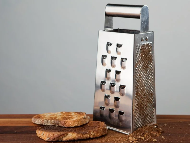Food Network Kitchen’s Grating Toast for Food Network's 14 Reasons to Love Your Box Grater, as seen on Food Network.