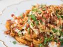 Beauty shot of loaded curly fry nacho, as seen on Food Network’s Trisha’s Southern Kitchen Season 11