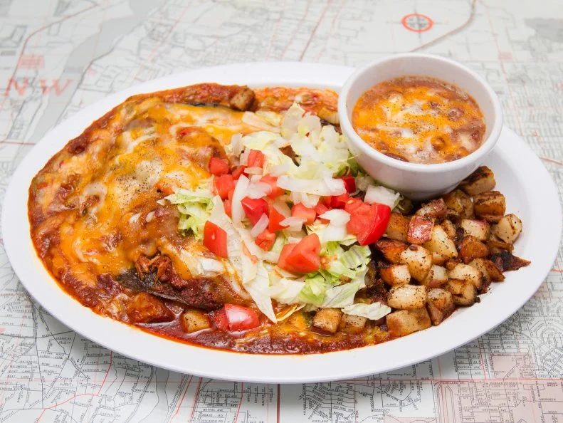 If you had to reduce New Mexican food to one word, there’s no question what that word would be: chile. Chile is the staple ingredient that distinguishes New Mexican from other regional cuisines, having been cultivated in the area for centuries. Red and green chiles come from the same plant; if a green chile is not harvested, it ripens and becomes red. Why are we sharing this chile trivia? Because in Albuquerque, chile is serious business. Just ask the folks at Tia Betty Blue’s, a beloved breakfast and lunch spot where you’ll find some of the hottest chiles around. (You can ask for mild, though.) Top menu picks include the huevos rancheros and enchiladas. Tia B’s other popular breakfast venue is La Wafflería, where you can customize the waffle of your dreams.
