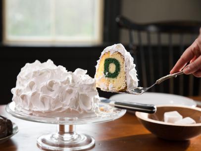 Host Gesine Bullock-Prado serving Dartmouth Cake, as seen on Baked in Vermont, Season, 1.