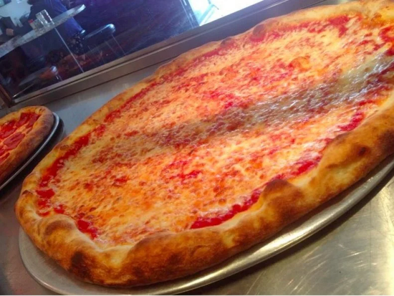 The Big Apple may be in the midst of a fancy-pizza renaissance, but the best old-school slice shops are as good as theyâ  ve ever been. A prime example: Joeâ  s Pizza. The Greenwich Village institution has been slinging inexpensive pies and slices for more than 40 years. The shop moved a couple blocks down from the original in 2005 and has expanded with three new locations, but Joeâ  s still serves the same thin-crust rounds coated with the proper balance of vibrant sauce and tasty cheese that have lured fans since 1975, and all for just $3 a slice.