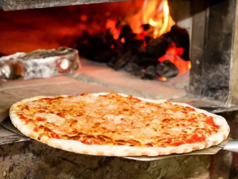 Pasquale â  Patsyâ   Lanceri opened this East Harlem coal-oven shop in 1933, after years of training under Gennaro Lombardi, the founder of Americaâ  s first licensed pizzeria. It has a lot in common with its predecessor. Like Lombardiâ  s, Patsyâ  s pies are cooked in a scorching-hot coal oven that creates that representative crisp crust marbled with black across the underside. The plain pie is simply topped with sweet tomato sauce and mild mozzarella cheese. Itâ  s a model of uncomplicated perfection. So what does set Patsyâ  s apart from the other early coal-oven joints? Itâ  s the only historic pizzeria to sell pizza by the slice, for less than the cost of the subway trip.