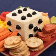A playing die made of cheese, as seen on Food Network's The Kitchen.