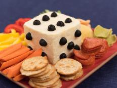 A playing die made of cheese, as seen on Food Network's The Kitchen.