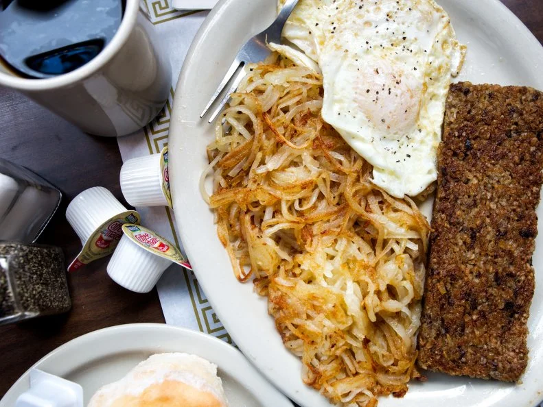 Northern Kentuckians cherish crisp-fried slices of goetta (pronounced “GET-uh”) for breakfast, in sandwiches and as part of “hangover cure” plates. Goetta manufacturers mix meat and broth with steel-cut oats and seasonings to make a mush, then shape the mixture into logs or blocks to sell to restaurants and home cooks. Cooks and chefs then slice or crumble it and fry until crisp. The venerable Anchor Grill in Covington — “We may doze but never close” — serves goetta around the clock, 365 days a year, and does not have far to go to buy it. Just across the road, Glier’s Goetta, founded in 1946, makes 1 million pounds of this German-influenced specialty food each year.