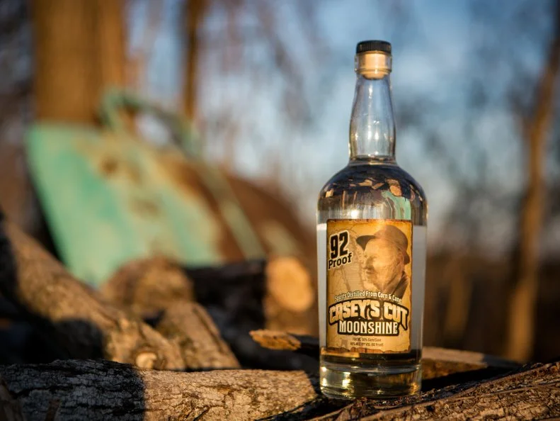Independent Kentuckians have made and sold their own alcohol for at least 200 years, including before, during and after Prohibition. Much of that alcohol could be called moonshine — unaged, high-proof, corn-based, distilled whiskey, often made illegally. Distillers like Casey Jones Distillery in Hopkinsville now produce legal moonshine in the light of day. Master distiller Arlon Casey Jones uses stills built on patterns his grandfather developed in Golden Pond, Kentucky, a town renowned for its Prohibition-era moonshine. Golden Pond ceased to exist when its residents were forced to move in the 1960s to make way for the Land Between the Lakes National Recreation Area.