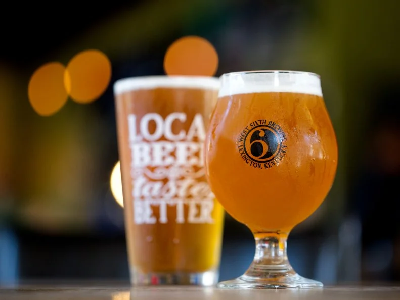 Bourbon may take top billing when it comes to Kentucky drinking, but the craft beer scene is thriving too. In 2012, Lexington’s West Sixth Brewing began brewing and serving beer in one corner of a historic bakery building called The Bread Box. The craft microbrewery now offers 15 to 20 beers on tap, and the Bread Box brims over with creative, community-minded businesses and nonprofits, including an inventive indoor farm at the heart of the building. Stores and restaurants across Kentucky sell West Sixth’s signature IPA and many other beers. Soon West Sixth beer will include ingredients grown on a newly purchased 120-acre Franklin County farm, 35 minutes from the brewery.
