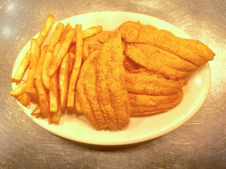 While fried catfish appears on menus in restaurants across Kentucky, it’s held in particularly high esteem by diners in western Kentucky. Willow Pond Southern Catfish in Aurora breads catfish fillets lightly and fries them to a crisp brown, serving them alongside well-praised sides, including hush puppies, vinegar slaw, baked potatoes and white beans. Condiments on each table include a sweet red pepper relish that most diners add to the beans — though it can be a dip for other foods as well. Willow Pond of Aurora opened in 1993, taking over from Sue and Charlie’s, a popular catfish restaurant founded in 1947, and it remains known for its warm, skilled service.