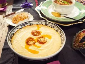 Host Tiffani Amber Thiessen's dish, Cheesy Grits with Blackened Butter, as seen on Cooking Channel’s Dinner at Tiffani’s, Season 3.