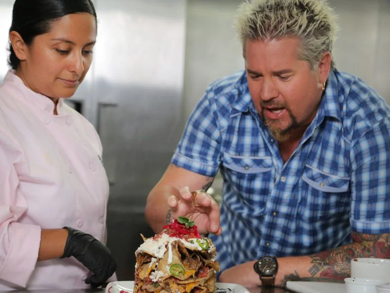 Host Guy Fieri and Chef and Owner Tanya Hernandez at Guy Fieri's Playa Del Carmen Kitchen and Bar in Centro, Playa Del Carmen, Mexico as seen on Food Network's Diners, Drive-Ins and Dives episode 2606.