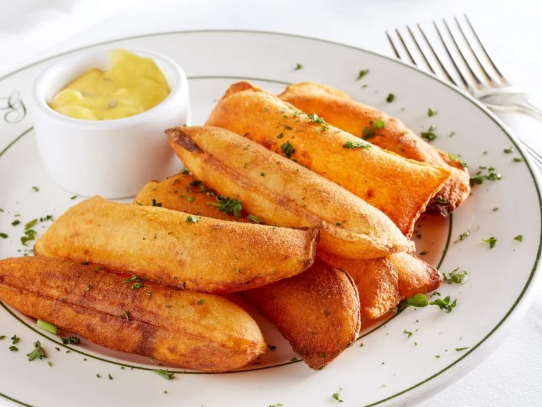 Galatoire's Souffle Potatoes; crispy potato puffs with bearnaise sauce