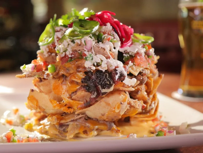 Trash Can Pork Nachos as served at Guy Fieri's Playa Del Carmen Kitchen and Bar in Centro, Playa Del Carmen, Mexico as seen on Food Network's Diners, Drive-Ins and Dives episode 2606.