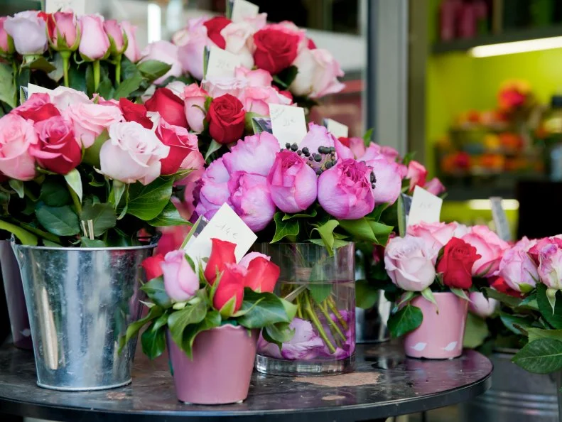 Bunches of fresh vivid colored flowers for sale outside a flower shop in the romantic city of Paris.