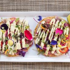 The Ahi Tostadas at Hacienda del Sol look like they could be a pretty little meal for “ladies who lunch,” but they pack a wallop both spicewise and in heft. Crispy tortillas are topped with seared rare albacore tuna, avocado aioli, watermelon radish, cilantro, Fresno chiles and edible flowers.