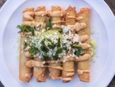 The rolled chicken tacos (aka taquitos) at Seis Kitchen are made by slow-stewing all-natural boneless, skinless chicken thighs in a mirepoix-chile stock. The shredded meat is then rolled in fresh corn tortillas, flash-fried and topped with a chipotle aioli, guacamole, queso fresco and chopped cilantro. Plus, one of the restaurant’s co-owners is a nutritionist, so it’s easier to pretend they’re good for you. 
