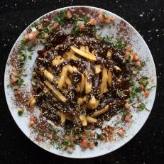 Zivaz has created something of a Southwestern spin on gravy fries in this decadent dish, which serves up a full pound of deliciously crispy french fries smothered in smoky-sweet, black mole sauce, under a sprinkle of sesame seeds. For an additional tingle, try shaking on a little hot sauce. 
