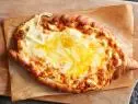Food Network Kitchen’s Georgian Cheese and Egg Bread (Adjarulin Khacgapuri).