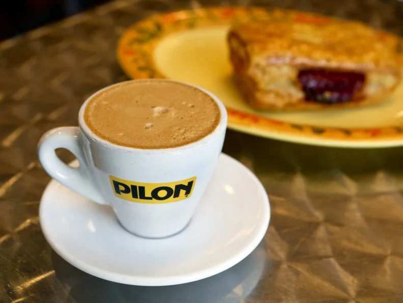 Portland and Brooklyn may be the poster cities of the third-wave coffee scene, but Miamians have long paid allegiance to caffeine, thanks to the cafe Cubano. The stimulating beverage should be within five minutes of any point in the Magic City. One of the best places to enjoy Cuban coffee is Enriqueta’s Sandwich Shop in Midtown. From a small service window, the staff here pulls the perfect cafecito — powerful doses of super-sweet coffee — served in espresso cups. Those who can’t handle the rocket-fuel power of the straight-up sugary brew can order a cortadito (essentially the Latin version of an Italian macchiato) or a cafe con leche with hot, steamed milk.