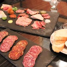 The Italians who settled large areas of Nevada were accustomed to the sight of homemade salumis, sausage and prosciutto curing in the cellar. Reno restaurateur Mark Estee has revived this time-honored tradition with his own line of masterfully handcrafted artisanal salumis, hams and other charcuterie at his newest eatery and market, Liberty Food & Wine Exchange. Bite-size tastes of his calabrese and cacciatore salumi, country pate and other meaty creations populate the delectable Rebel Plate.