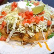 Members of the Las Vegas Paiute tribe typically offered fry bread tacos only at special events like pow wows and rodeos. That changed in 1995 when the tribe opened the gorgeous Las Vegas Paiute Golf Resort northwest of Las Vegas. Originally a seasonal special, the addictive tacos proved so popular that theyâ  re now on the permanent menu, fried in a cast iron pan and topped with housemade chili, shredded cheese, lettuce, tomato, sour cream and house salsa.