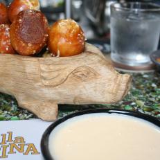 The name of this Philadelphia gastropub means "from the tap" in Italian, so you can be sure that its draft game is on point. But in addition to the suds sourced from both local and Italian breweries, Alla Spina draws the crowds with its elevated take on typical pub fare. One signature dish is a beer cheese dip whose silky cream cheese base is punched up by the addition of a spicy Asiago fresco and a Belgian-style witbier. It's accompanied by a side of housemade signature soft pretzels, perfect for plunging into the luscious, bubbly dip.