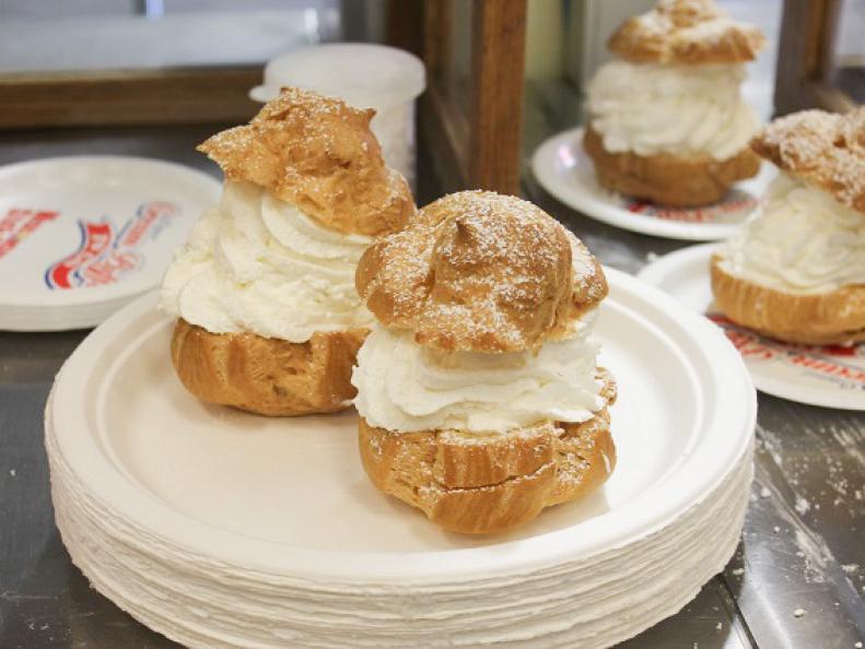 European-born cream puffs earned local status at the Wisconsin State Fair during the 1940s, when visitors queued up in the Wisconsin Bakers Association’s facility there to get a rare taste of a wartime scarcity, whipped cream. Bakers heaped dense clouds of it into golden pastry puffs and showered the treats with powdered sugar. No wonder the demand turned into a tradition. Today, visitors down some 50,000 cream puffs a day during the fair’s two-week run. Can’t make it to the state fair? Then get thee to a dairy festival or county fair, where the longest line at the event will lead you directly to a cream puff truck or stand.