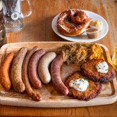 Food Network; Philadelphia RestaurantsBrauhaus Schmidtz,The Dish is our Wurstbrett -wooden board of all our Sausages and two side dishesNurnberger Bratwurst - pork sausage, marjoram, caraway, mace and gingerBauernwurst - smoked beef and pork sausage, garlic, black pepper, mustard seedSpeckwurst - smoked bacon sausage, black pepperUngarischewurst - smoked pork sausage, spicy paprika, garlic, red winePfefferbeisser - smoked pork sausage, black pepper, paprikaWeisswurst - veal and pork sausage, parsley, nutmeg, white pepperside dishesSauerkraut - beer braised Sauerkraut with baconPotato Pancake - Potato pancake with onion, salt, pepper and parsley.