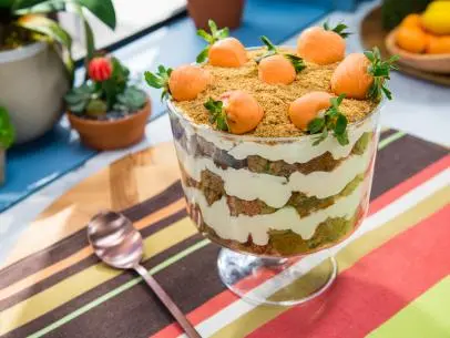 Sunny Anderson, Marcela Valladolid, Geoffrey Zakarian, and Katie Lee Pass The Carrot Cake Trifle, as seen on Food Network's The Kitchen