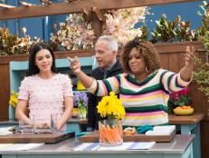 Sunny Anderson makes a Spring Table Floral Arrangement with Orange Flowers and Carrot Vase, as seen on Food Network's The Kitchen