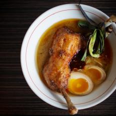 Japanese street food meets Midwestern Americana at this Omaha restaurant, which serves Harvest Chicken Ramen. The hearty dish starts with an Asian-inspired broth that they call a "chork" broth, made with a mix of locally sourced chicken and pork. Classic ramen noodles are added, then topped with a crispy braised quarter of chicken, a few soft-boiled eggs, mustard greens and pickled Nebraskan corn.