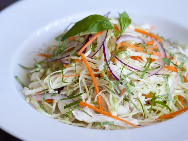 "Vietnamese style chicken and cabbage salad with carrot, onions and Vietnamese coriander."