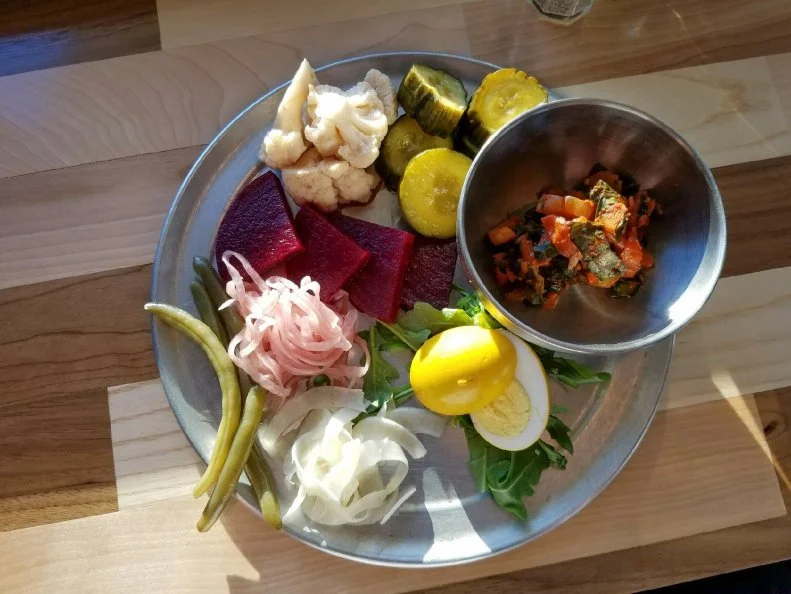 To get through the long, barren winter, Vermonters used to can and pickle everything they could fit in jars, including cucumber â  tongue picklesâ   (made from overgrown cucumbers, the round ends resembling tongues), fruit and even eggs. Large jars of pickled eggs can still be found sitting on some general store and deli counters, including the one at Gillâ  s Delicatessen in Rutland, where they make their own vinegar-garlic version. Restaurant chefs have also taken to pickling eggs in creative ways, including a turmeric-tinted one served on the housemade pickle plate at Hired Hand Brewing Co. in Vergennes.