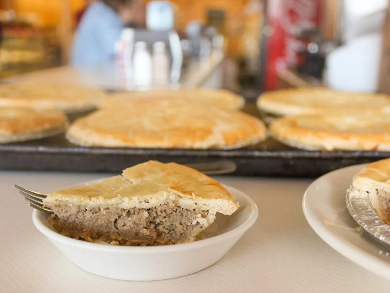 French Canadian immigrants brought many recipes to Vermont, but Quebecois meat pie, called tourtiere, stands out. Families baked dozens for end-of-year celebrations that lasted through the night. The two-crusted pies are usually filled with ground beef and pork, onions, mashed potato, cinnamon, and cloves. Quality Bake Shop in Essex Junction has made them for more than 30 years, based on a family recipe.