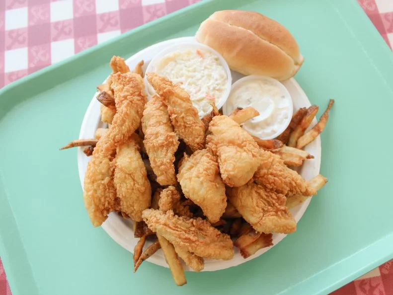 There is a long history of fishing in and around Lake Champlain. In winter, small ice-fishing huts sprout on its surface. Since 1951, family-owned Ray’s Seafood has bought buckets of yellow perch and other lake fish from local anglers. At the family's Essex Junction location, they serve the haul as excellent fried perch fillets in a light, crunchy batter. Ray’s also wholesales to other restaurants like Bleu Northeast Seafood in Burlington, where the fried perch sandwich comes with spicy slaw and Old Bay aioli. The preparation makes it easy to taste why lake perch have been called “poor man’s shrimp.”