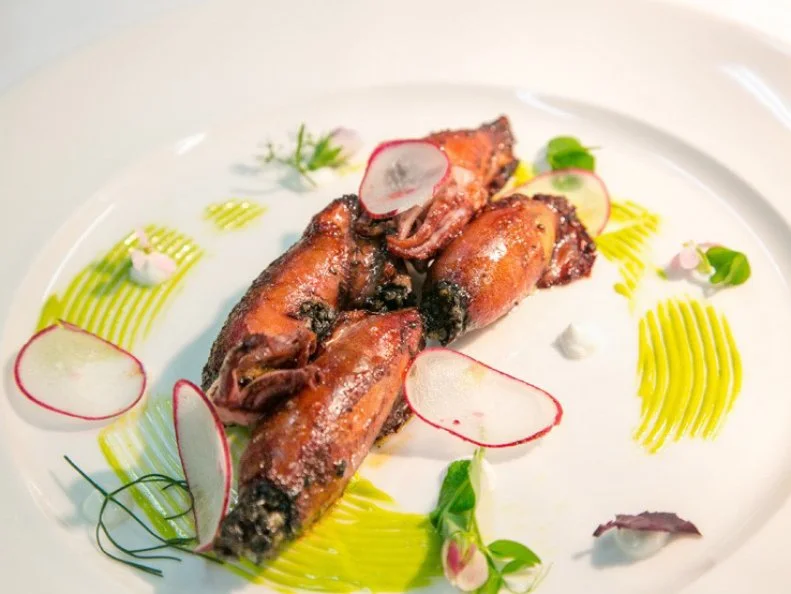 Among the earliest edible greens to sprout through the frosty Vermont soil are ramps, or wild leeks. They are as eagerly anticipated by chefs today as they were welcomed by native Abenaki. Resembling scallions with an increasingly pungent bite as they mature, ramps are suited to various spring preparations, including pickling and grilling. On restaurant menus, they might punctuate a dish like the braised oxtail-stuffed squid with spring radishes and grilled ramp aioli served at the James Beard Foundation Award-nominated SoLo Farm and Table in South Londonderry, or you might find them starring in the ramp and potato soup with ramp dumplings at Ariel’s Restaurant in Brookfield.
