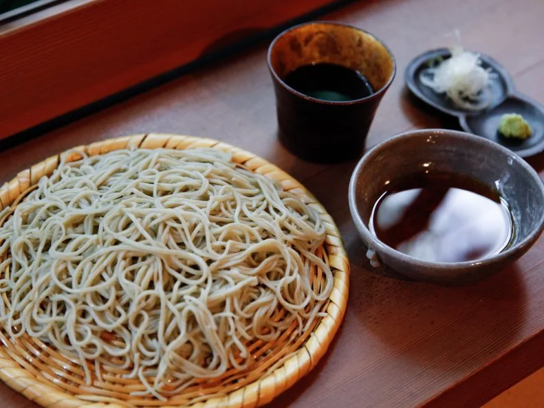 At this venerated soba restaurant, Tadashi Hosokawa uses 100 percent freshly milled buckwheat flour to make his legendary noodles. The resulting texture is delightful, with a heft and pleasant chewiness that wheat-flour noodles lack. Dipped in a smoky soy-based sauce that offsets the nutty flavor of the buckwheat, Hosokawa’s soba is best enjoyed with a side of delicate anago eel tempura or juicy, flash-fried eggplant. With elegant hardwood tables and earth-toned walls daubed in a mixture of mud and straw, the space is warm and inviting.