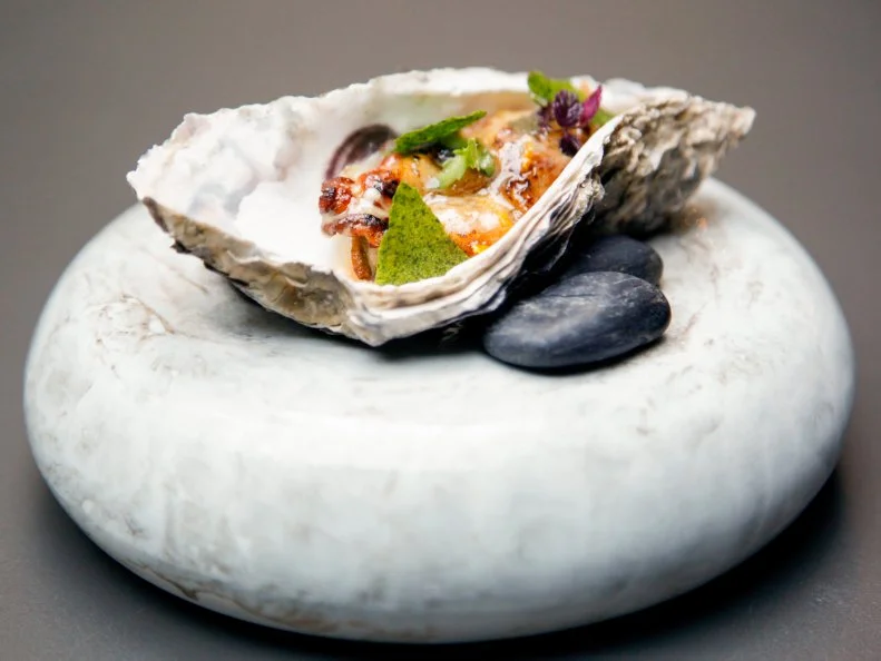 Shinsuke Ishii takes a fun and innovative approach to French cuisine at Sincere, which opened to rave reviews in early 2016. The tasting menu showcases refined interpretations of bistro classics, each with a Japanese twist. A poached oyster comes on the half-shell, bathed in vermouth-spiked brown butter and dotted with Japanese micro-herbs and nori crackers; the flaky fish pie, stuffed with sea bream and placed on a vermillion pool of lobster veloute, resembles taiyaki, a fish-shaped Japanese confection typically filled with sweet bean paste. The gleaming open kitchen makes every seat in the intimate space feel like a spot at the chef’s table.