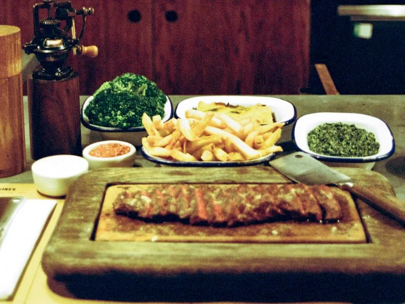 Taking our cue from Flat Iron and its impressively concise menu, we'll get straight to the point. The reason to come here is simply meat. Steak, in fact; specifically, the cheaper cut known as flat iron, served here with a house leaf salad for just 10,00 pennies. (That's 10 pounds.) If you want to bulk up your order, add creamed spinach, daily market greens and dripping-cooked chips, or peg on a couple of seasonal salads; there's also a salted-caramel sundae to sate your sweet tooth. Alcohol gets a tad more airtime, with a short selection of craft beers, a solid assembly of wines and a pleasing cast of cocktails, including a punchy plum-and-aperol spritz and an aromatic old-fashioned that works its magic with help from blood-orange oil.